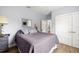 Neutral bedroom features wood floors, a ceiling fan, and an ensuite bathroom at 2623 57Th S St, Gulfport, FL 33707