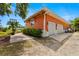Spacious garage with two doors, a basketball hoop, and well-maintained exterior features at 2623 57Th S St, Gulfport, FL 33707