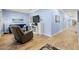 Bright and airy living room with wood floors, blue walls, and comfortable armchair seating at 2623 57Th S St, Gulfport, FL 33707
