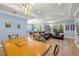 Open living room with wood floors, pool table, comfortable seating, and abundant natural light at 2623 57Th S St, Gulfport, FL 33707