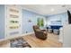 Cozy living room with wood floors, blue walls, and comfortable seating near the door at 2623 57Th S St, Gulfport, FL 33707