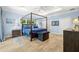 Serene main bedroom with wood floors, a canopy bed, and large windows at 2623 57Th S St, Gulfport, FL 33707