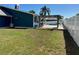 Spacious backyard with a pergola, picnic bench and refreshing pool for outdoor enjoyment at 3000 Tangerine Ter, Palm Harbor, FL 34684