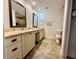 This bathroom features a double sink vanity with lots of storage and tile floors at 3000 Tangerine Ter, Palm Harbor, FL 34684