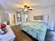 The main bedroom is spacious with a ceiling fan and direct access to the bathroom at 3000 Tangerine Ter, Palm Harbor, FL 34684
