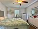 This bedroom features a ceiling fan, bright walls, and lots of closet space at 3000 Tangerine Ter, Palm Harbor, FL 34684