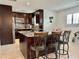 Beautiful kitchen island featuring granite countertops, stainless steel appliances, and seating at 3000 Tangerine Ter, Palm Harbor, FL 34684