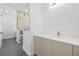 Modern bathroom featuring double shower, sleek vanity with stone countertop and bronze faucet at 3020 W Helen Ave, Tampa, FL 33611