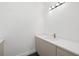 Modern bathroom featuring sleek vanity with stone countertop and bronze faucet at 3020 W Helen Ave, Tampa, FL 33611