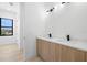 Double vanity bathroom with modern lighting at 3020 W Helen Ave, Tampa, FL 33611