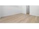 Spacious bedroom featuring hardwood flooring and neutral color scheme at 3020 W Helen Ave, Tampa, FL 33611
