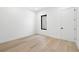 Light-filled bedroom with a window and minimalist design at 3020 W Helen Ave, Tampa, FL 33611