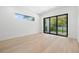 Bedroom with sliding doors to a patio and bright natural light at 3020 W Helen Ave, Tampa, FL 33611