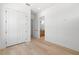 Bright bedroom featuring hardwood floors, closet and bathroom access at 3020 W Helen Ave, Tampa, FL 33611