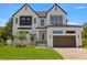 Stunning two-story home boasts modern design, white brick, black accents, and a manicured front yard at 3020 W Helen Ave, Tampa, FL 33611