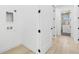 Hallway and laundry room with modern appliances at 3020 W Helen Ave, Tampa, FL 33611