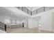 Spacious open-concept living room with modern finishes, high ceilings, and view to the kitchen at 3020 W Helen Ave, Tampa, FL 33611