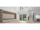 Stylish living room showcasing modern design, high ceilings, wood floors, and sleek built-in cabinets at 3020 W Helen Ave, Tampa, FL 33611
