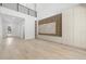 Bright open-concept living room features wood floors, modern built-ins, and high ceilings with balcony view at 3020 W Helen Ave, Tampa, FL 33611