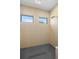 Modern shower with stylish wall tiles, rainfall shower head and two modern windows at 3020 W Helen Ave, Tampa, FL 33611
