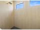 Modern shower with stylish wall tiles, rainfall shower head and a modern window at 3020 W Helen Ave, Tampa, FL 33611