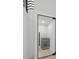 Wine cellar with glass door, showcasing sleek beverage cooler at 3020 W Helen Ave, Tampa, FL 33611