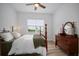 Sun-filled bedroom showcasing a four-poster bed and a beautiful view through a large window at 3409 Gulf City Rd, Ruskin, FL 33570