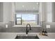 Kitchen with large window above sink that offers a scenic lake view at 3409 Gulf City Rd, Ruskin, FL 33570