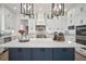 Stylish kitchen with a large island, stainless steel appliances, and custom cabinets at 3409 Gulf City Rd, Ruskin, FL 33570