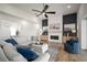 Cozy living room with fireplace, built-in cabinets, and comfortable seating at 3409 Gulf City Rd, Ruskin, FL 33570
