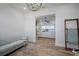 Living room with seamless flow and wood flooring and view through to the water at 3409 Gulf City Rd, Ruskin, FL 33570