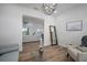 Open-concept living room with wood flooring and views into other living spaces at 3409 Gulf City Rd, Ruskin, FL 33570