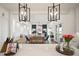 Bright, open-concept living space with modern lighting, wood floors, and stylish decor at 3409 Gulf City Rd, Ruskin, FL 33570