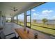 Enjoy the outdoors from this screened-in patio with scenic lake views, perfect for relaxing and dining at 3409 Gulf City Rd, Ruskin, FL 33570
