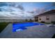 The bright and modern pool is surrounded by beautiful landscaping and green space with a view of the lake at 3409 Gulf City Rd, Ruskin, FL 33570