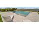 Beautiful pool with large patio, water feature, and lake view at 3409 Gulf City Rd, Ruskin, FL 33570