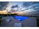 Stunning pool with modern design, underwater lighting, and beautiful lake views, perfect for relaxation at 3409 Gulf City Rd, Ruskin, FL 33570