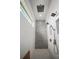 Elegant shower stall features a rainfall shower head and built-in shelves for toiletries at 3409 Gulf City Rd, Ruskin, FL 33570