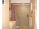Updated bathroom featuring a shower with tiled walls, and colorful accents at 4179 Juniper St, Port Charlotte, FL 33948
