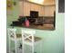 Bright kitchen with breakfast bar and additional seating, perfect for casual dining at 4179 Juniper St, Port Charlotte, FL 33948