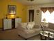 Relaxing living room with cozy seating, ambient lighting, and decorative accents at 4179 Juniper St, Port Charlotte, FL 33948