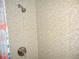 Updated shower featuring mosaic tile walls and modern fixtures at 4179 Juniper St, Port Charlotte, FL 33948