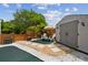 Backyard with a shed, comfortable white chairs, and a small table with an umbrella at 4240 Woodsville Dr, New Port Richey, FL 34652