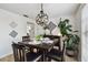 Elegant dining area featuring a stylish table, modern decor, and abundant natural light at 4240 Woodsville Dr, New Port Richey, FL 34652