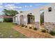 A walkway to the front door with decorative stone and shrubbery at 4240 Woodsville Dr, New Port Richey, FL 34652