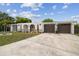 Lovely home exterior with a well-kept driveway and attached two-car garage at 4240 Woodsville Dr, New Port Richey, FL 34652