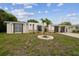 Well-maintained home exterior with a decorative front yard and attached two-car garage at 4240 Woodsville Dr, New Port Richey, FL 34652