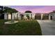 Inviting home exterior featuring a manicured lawn and unique architectural details at 4240 Woodsville Dr, New Port Richey, FL 34652