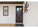 Close up of front door with a screen door and decorative hardware at 4240 Woodsville Dr, New Port Richey, FL 34652