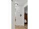 Bright hallway leading to bathroom and bedroom with modern flooring at 4240 Woodsville Dr, New Port Richey, FL 34652